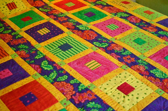 Celebrate, Cotton quilt with fall colors. Quilter,  Joanne Nolt; Fabric design by, Yvonne Porcella.