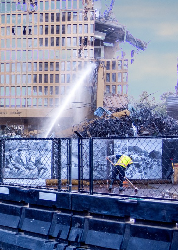 Workman cleaning up after a hard day destructing Meyer Library, Stanford